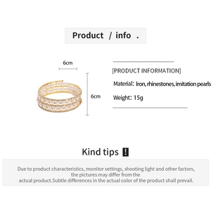 Detail view of multi-layer spiral cuff bracelet with pearls and rhinestones