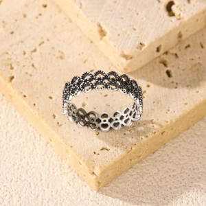 S925 sterling silver lace pattern heart ring on natural textured stone background