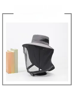 Detail view of dark grey outdoor hat featuring fine black protective mesh for mosquito control