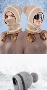 Detail of knit balaclava hat showing thick fleece lining and fluffy faux fur pompom