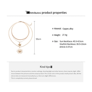 Detailed size specifications for layered golden necklace with sun and starfish charms
