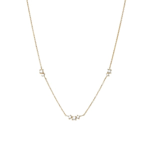 Macro detail of gold S925 sterling silver chain with three sparkling zirconia settings