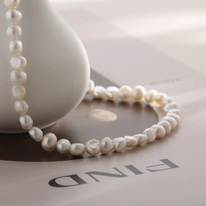 Detailed view of Baroque pearl necklace with irregular pearls and OT toggle clasp