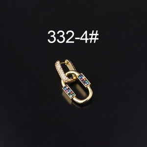 Macro shot of gold-plated chain link earrings featuring multicolor cubic zirconia stones