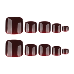Glossy deep wine red press-on toenails set displayed on a clean white background