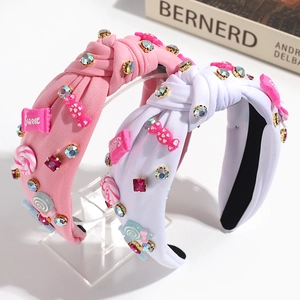 Sweet pink and white knotted headbands with colorful candy charms and rhinestones