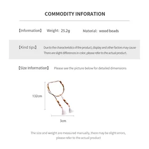 Detailed view of bohemian wood bead waist chain featuring fringe tassels and 132cm length