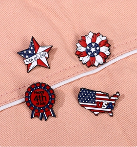 Detailed macro of 4th of July American flag themed enamel lapel pins on fabric