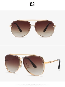 Detail of vintage aviator sunglasses with gold double bridge metal frame and brown lenses