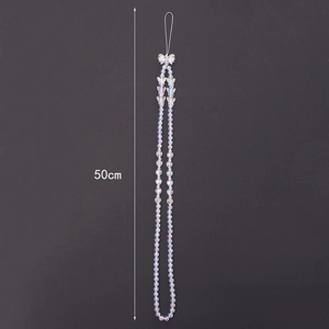 Detailed view of iridescent heart and pearl phone lanyard measuring 50cm in length