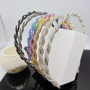 Macro shot of twisted headbands with colorful rhinestones in gold, silver and black