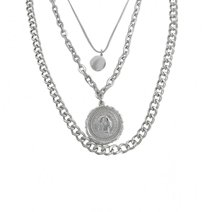 Three-layer silver metal necklace featuring snake chain and coin pendant with 1983 engraving