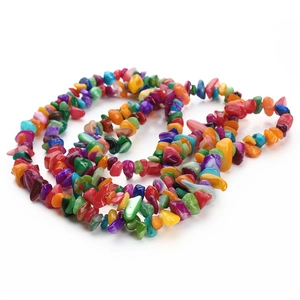 Macro shot of colorful irregular shell beads for DIY jewelry and necklace crafting