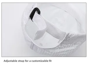 Detail of adjustable Velcro strap and mesh fabric on a white breathable baseball cap