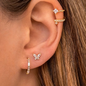 Detail view of 4-piece gold butterfly ear cuff and stud set with colorful zircon stones