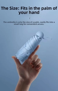 Mini portable five-fold umbrella in light blue shown against palm for size comparison