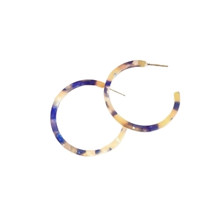 Vintage C-shape resin hoop earrings with blue and amber marble texture on white background