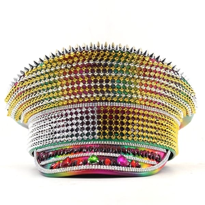 Detailed view of colorful rhinestones, metal spikes and gemstones on the party captain hat