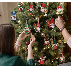 Close-up of 12pcs wooden Christmas gnome ornaments hanging on a tree for festive DIY decor
