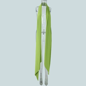 Detail of light green halter strap on a knitted dress showing texture and drape