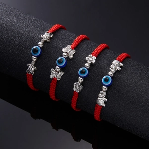 Set of 4 handmade red braided evil eye bracelets with animal charms and blue beads