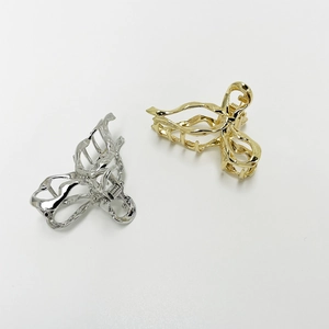 Bow-knot style metallic hair claws in gold and silver finish for elegant hair styling