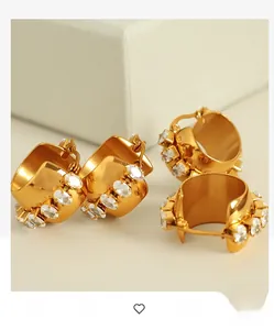 Detail shot of four 18K gold plated C-shaped hoop earrings with white zircon inlay