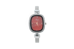 Detailed macro view of an oval silver watch with crystal bezel and red sunray dial