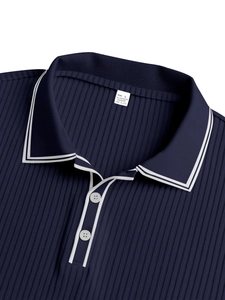 Close-up of dark blue striped polo shirt collar showing fabric texture and size label
