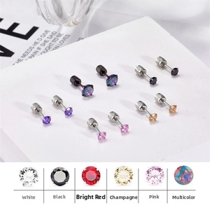Close-up of colorful round zircon stud earrings with secure screw-back closure
