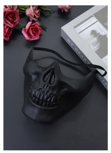 Detail of black skeleton half-face mask with textured teeth for Halloween cosplay