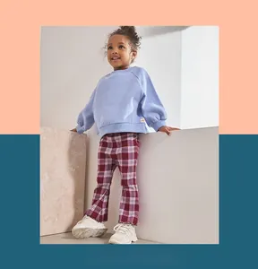 Girl's red tartan flared leggings with classic plaid pattern and a casual fit