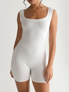Detail of square neck and ribbed texture on white sleeveless athletic romper