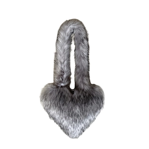 Detail of silver gray heart-shaped faux fur tote bag with long fluffy texture