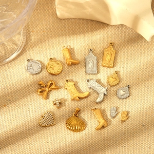 Vintage stainless steel gold pendants featuring western boots, hearts and crosses