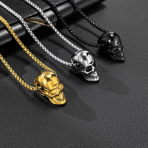 Three gothic skull pendants in gold, silver, and black with durable box chain necklaces