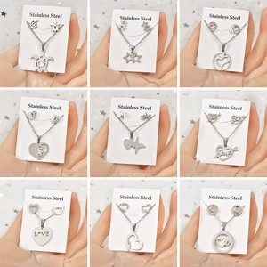 Nine sets of silver stainless steel heart and star jewelry sets on display cards