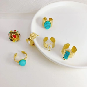 Set of five 14K gold stainless steel rings with turquoise, floral patterns and crystals