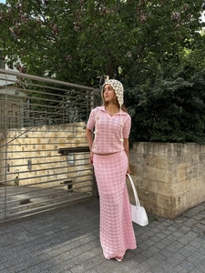 Detailed knit texture of pink crochet hollow-out polo top and matching maxi skirt set