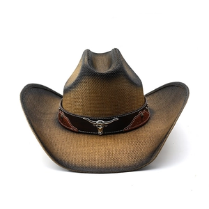 Western style woven straw cowboy hat with brown leather band and silver bull buckle detail
