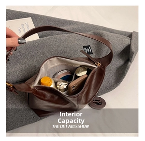 Macro view of the spacious interior of a brown leather hobo bag for daily essentials