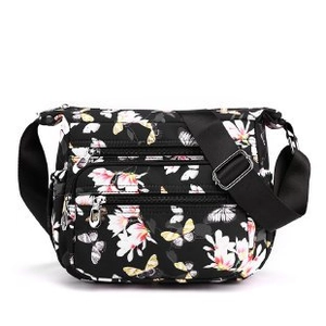 Floral nylon crossbody bag with butterfly print and multi-zipper compartments