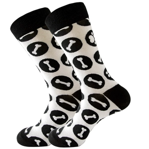 Classic black and white knit crew socks featuring bone patterns and ribbed cuffs