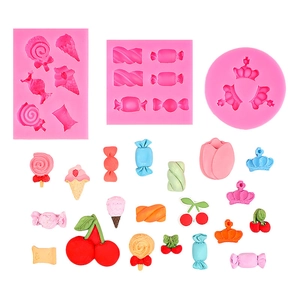 Pink silicone mold set for creating candy, cherry, and crown shaped cake decorations