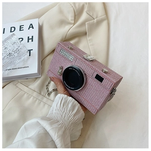 Pink tweed camera shaped bag with metal chain strap and creative lens detail