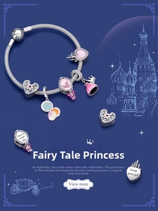 Macro detail of S925 silver charm bracelet featuring pink enamel castle and heart charms