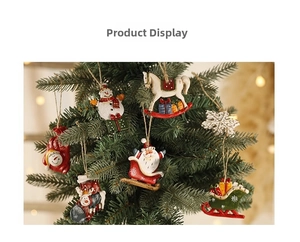 Detailed view of hand-painted resin Christmas ornaments hanging on a festive tree branch