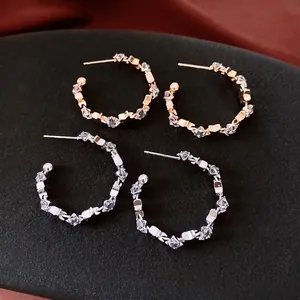 Star-pattern C-shaped hoop earrings with silver pins and cubic zirconia crystals