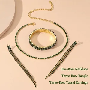 Detailed set of gold plated emerald rhinestone necklace bracelet and fringe earrings
