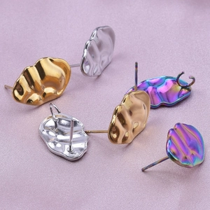 Macro view of 304 stainless steel wavy geometric earring findings in gold silver and rainbow